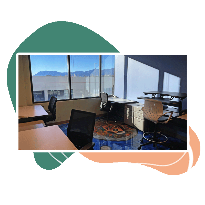 A dedicated flex workstation area with desks and seating for multiple people.